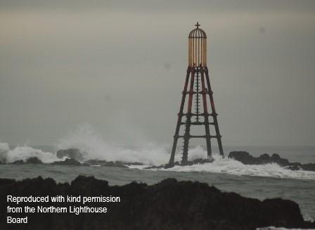 East Vows Beacon, standing on part-submerged reef off Elie Harbour. Cloudy and windy day at sea.  