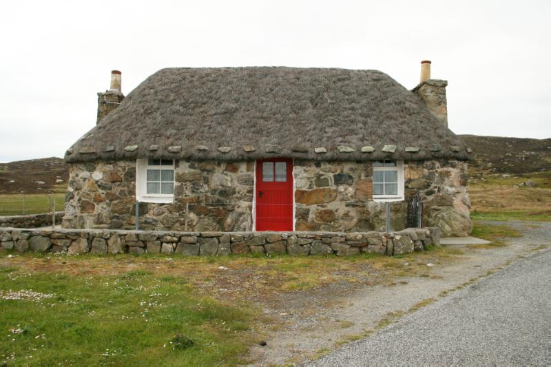 Evat Cottage, 466 South Lochboisdale, principal elevation, looking southwest, during daytime. 