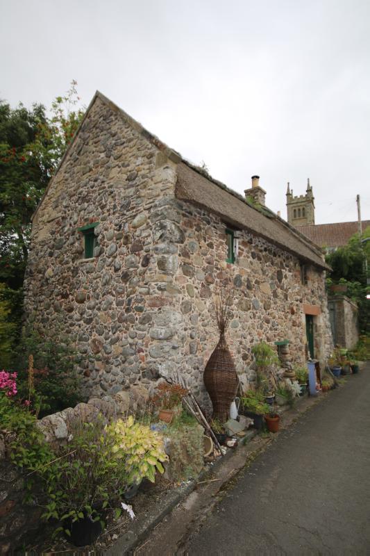 Thatched Studio, principal elevation, looking east during daytime. 