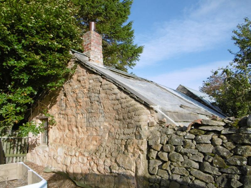West outbuilding at Corse Croft, south gable looking north during daytime. 