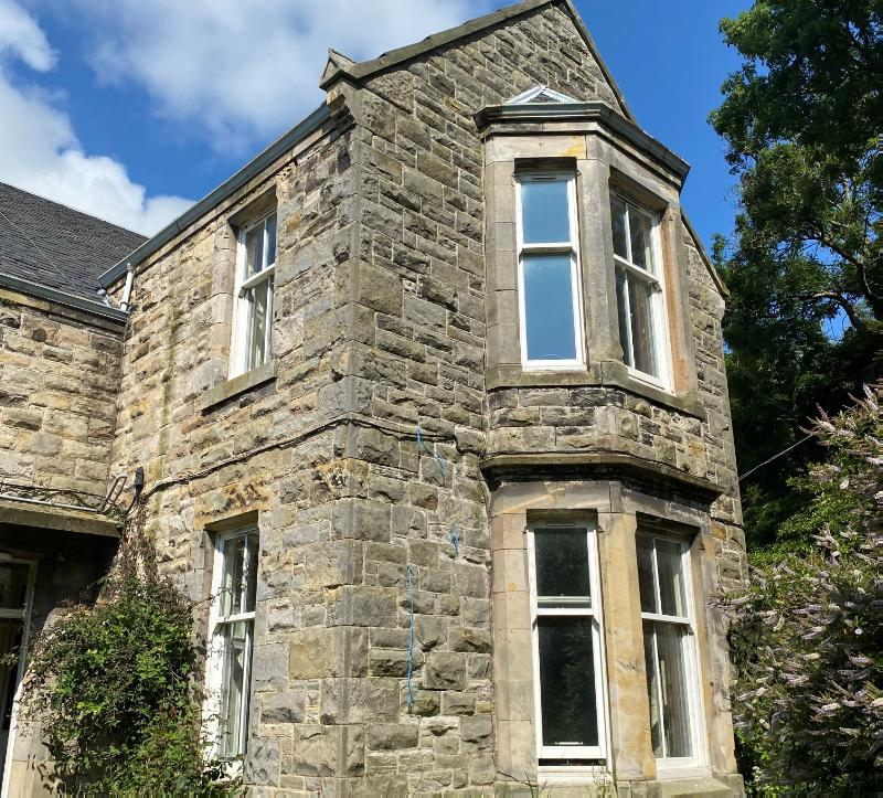 Craigencalt Mill, farmhouse, principal elevation, looking east, during daytime with blue sky.