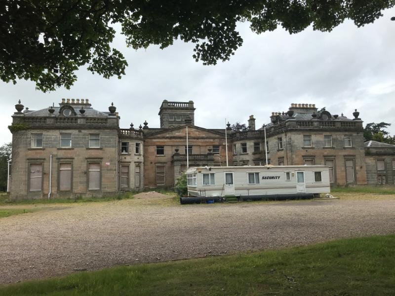 Letham Grange House, principal elevation, with caravan in foreground, looking west, during daytime, on overcast day. 