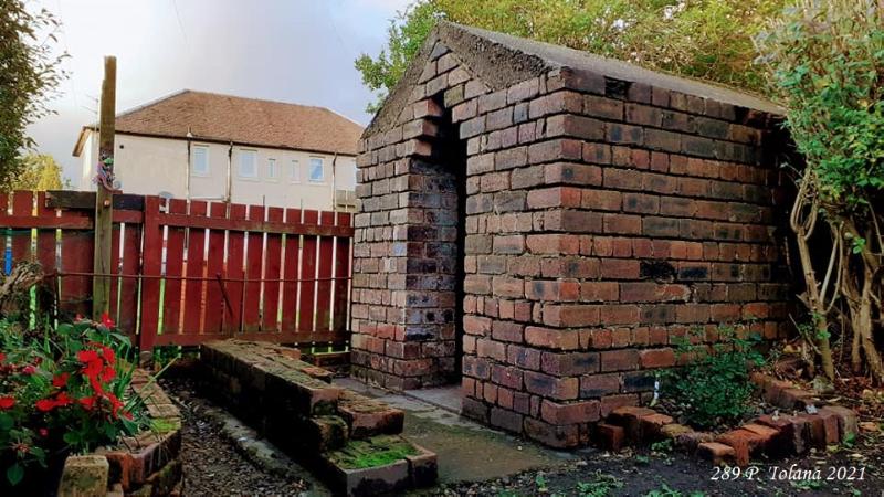 Domestic air raid shelter to the rear of 68-70 Haugh Street, Bainsford, Falkirk, looking north during daytime, on a cloudy day. 