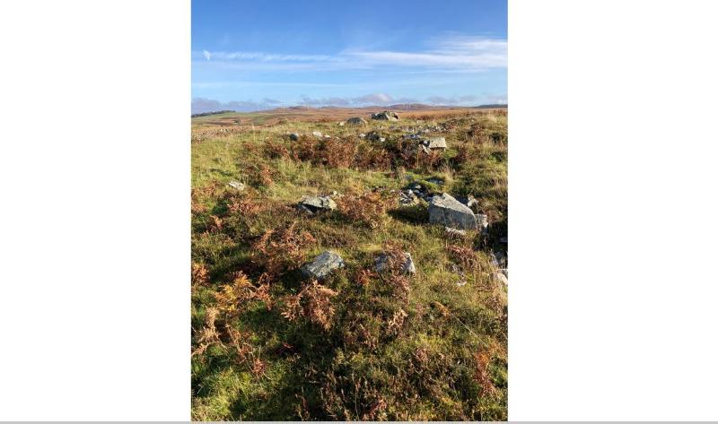  General view of Caves of Kilhern chambered cairn, 760m SSW of Dranigower looking northeast on a clear day with blue sky. 