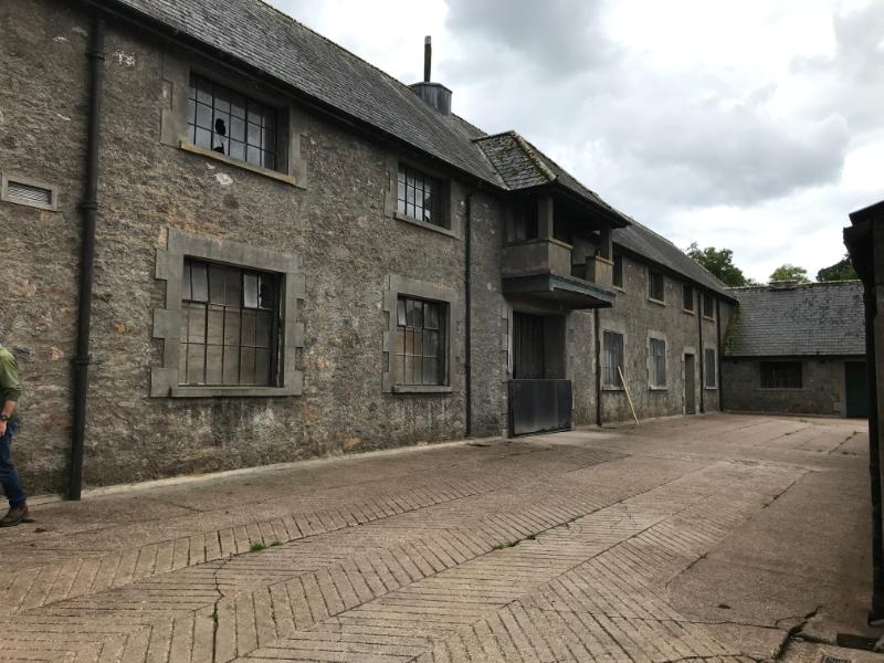 1930s ‘model farm’ steading at Leys Castle, south side of the courtyard, looking southwest. 