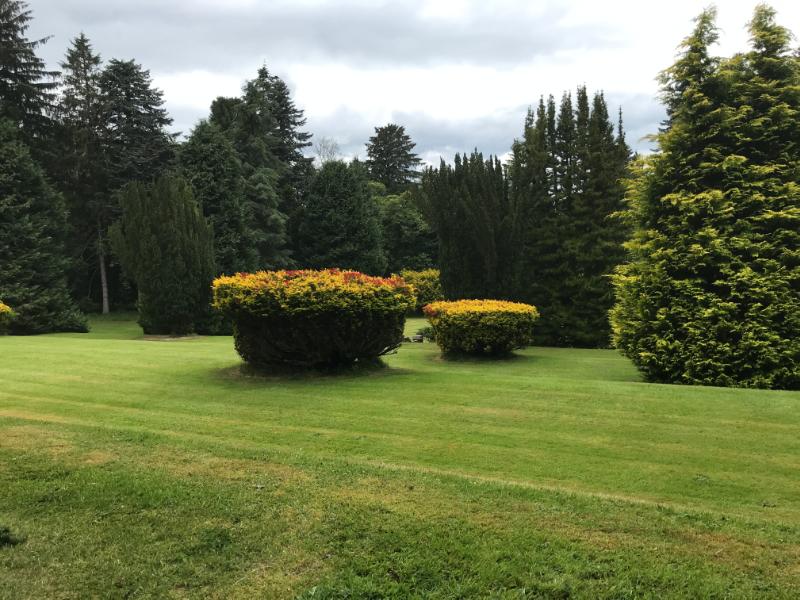 Leys Castle, upper terrace, looking northwest, during daytime on a cloudy day. 