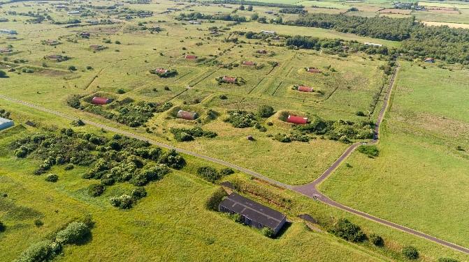 An aerial view of the Eastriggs site showing the location of the nitroglycerine production area, Hill 3 looking north northwest on a sunny day.  