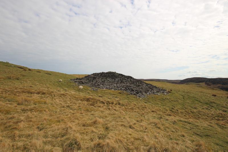 Four cairns, 570m WSW, 345m SW, 355m SW and 385m SSW of The Glen, looking east southeast (Eastmost cairn) on clear day with blue sky.  