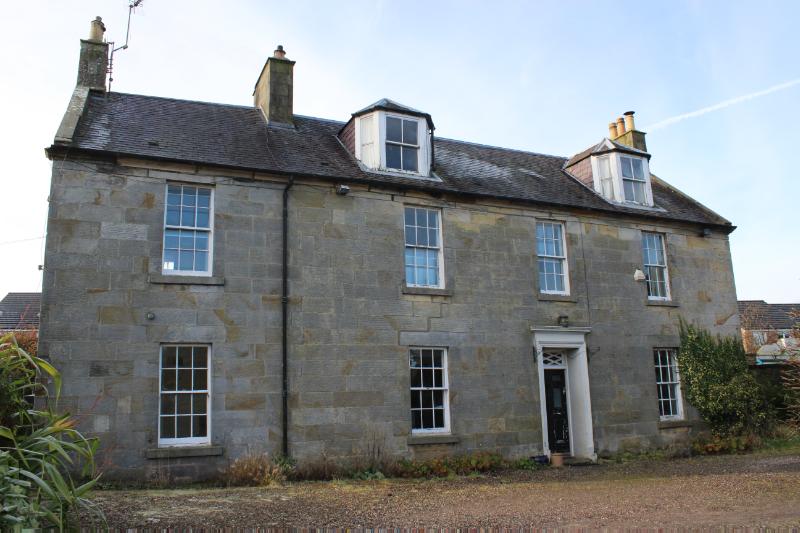 Levenbank, principal elevation, looking west, during daytime, on clear day with blue sky.