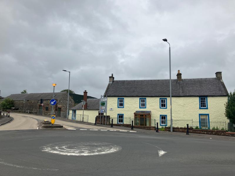 Mossmark of Oldmill, main (east) elevation of farmhouse with steading and former mill building to left side, looking west. during daytime with cloudy sky