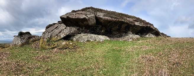 Rock shelter and prehistoric occupation site, 500m NNW of Meallabhan looking northwest during daytime, on clear day with blue sky.  