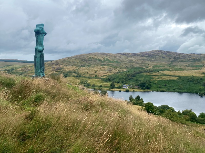 Upright Motive No.1: Glenkiln Cross, Margreig Hill, looking east towards Glenkiln Reservoir, during daytime with breaking cloud