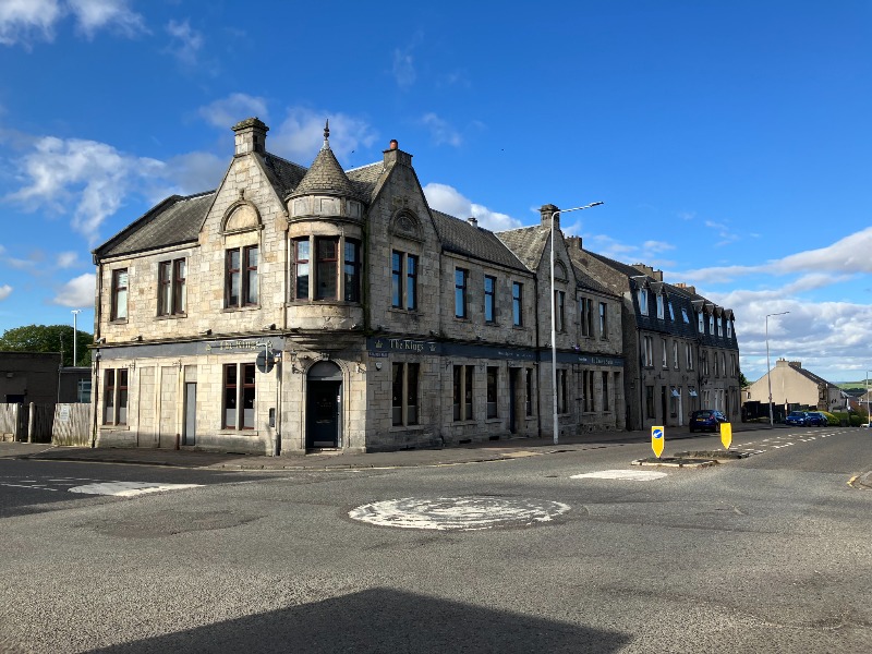 2-8 Main Street, Kelty, main elevations, looking northeast, during daytime, on clear day with blue sky. 